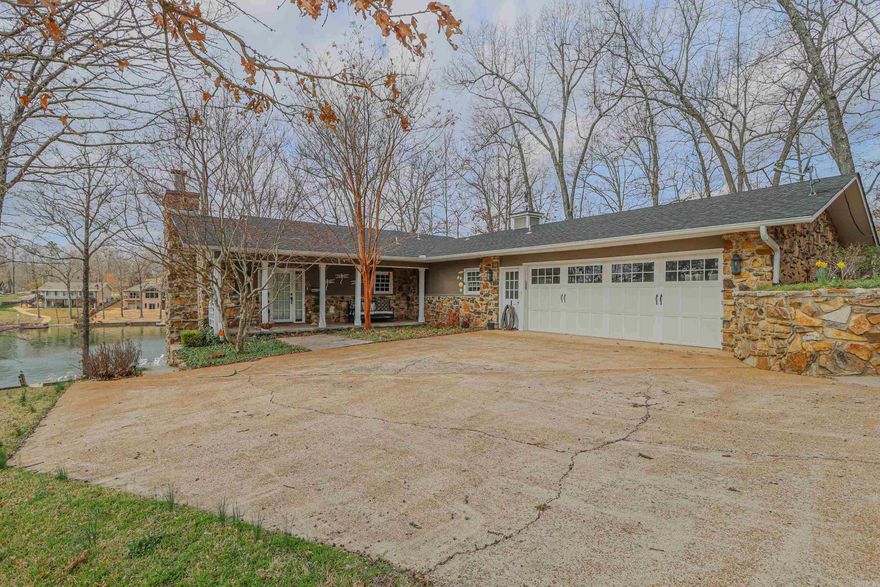 Discover the charm of this inviting lakeside retreat, nestled gracefully overlooking the serene waters of Lake Thunderbird. Recently updated with a touch of modern flair, this home offers a comfortable and welcoming ambiance. Step inside to find an airy open floor plan, boasting quartz countertops, a cozy breakfast bar, and a generous dining area perfect for casual meals or intimate gatherings. Relax and unwind on the screened porch, offering a tranquil space to enjoy the sights and sounds of nature. Downstairs, a spacious living area awaits, complete with a warming fireplace and versatile Murphy beds for added convenience.Make your way outdoors along the gently winding concrete path to reach the waterfront oasis, a peaceful retreat where you can soak in the beauty of the surroundings. And rest assured, this charming property comes fully furnished, ready to welcome you to your new lakeside lifestyle with ease and comfort. New roof fall 2022