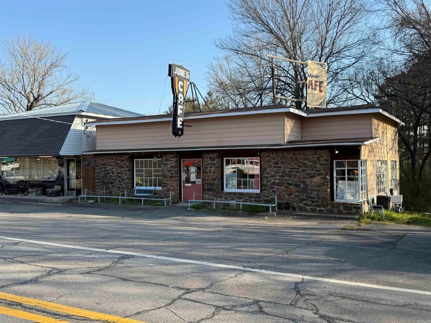 Historic commercial opportunity in the heart of Clinton! Formerly known as June’s Café, this iconic property dates back to 1938 and was once a beloved stop along U.S. Highway 65 in the Ozarks. For decades, June’s Café built a strong reputation for classic home-style cooking and was widely recognized as one of the most popular dining destinations in the region during the mid-20th century.  Over the years, the café operated under various owners—most recently as J & S June’s Café—while preserving its longstanding local charm and nostalgic appeal. The building now stands ready for its next chapter, offering a rare chance to own a piece of Van Buren County history.  The property is being sold without restaurant equipment, providing a blank slate for renovation or repurposing. Whether you envision reopening a dining establishment, creating a retail space, or developing something entirely new, this high-visibility location offers excellent potential.  Don’t miss this unique opportunity to restore and reimagine a well-known local landmark with deep roots in the community.