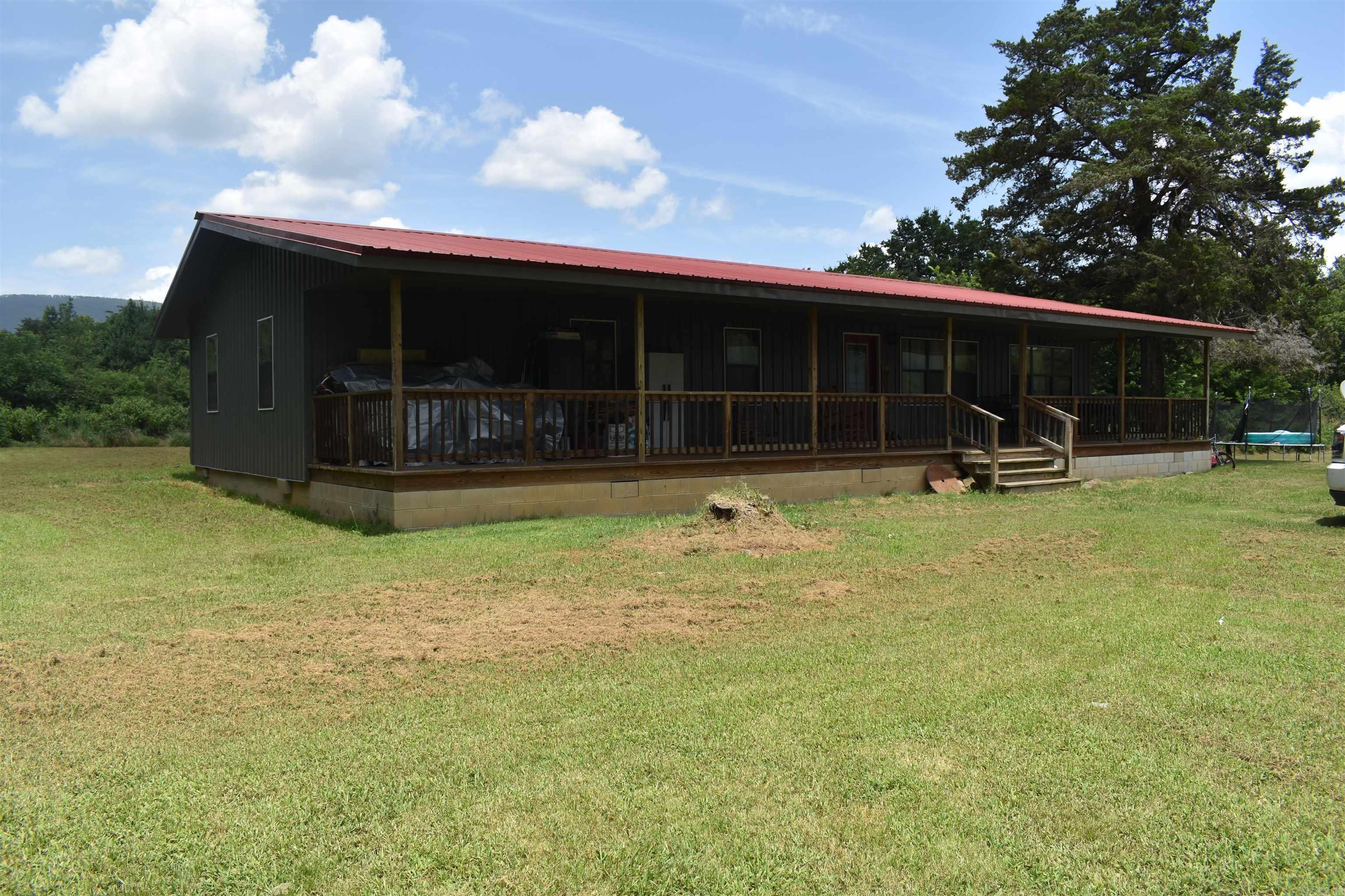 Located in the peaceful Dutch Creek Valley, this recently updated country home is in a great location for recreation and seclusion. Boasting 2064 square feet, along with a ten-foot covered front porch there is plenty of space for the entire family. Freedom Creek borders the property on its west side, giving rear-round reactional opportunities that pair perfectly with the National Forest access that is just a short drive down the county road. The four-bedroom two bath home has an open concept living area, with a nice sized kitchen and a living room spacious enough for the entire family. A large master suite located on the rear of the home was recently added, complete with an oversized tile shower, as well as a walk-in closet with plenty of space for everyone. 2064 Square Foot Home ⢠3.5 +/- Acres ⢠Year-round creek frontage ⢠Recently remodeled ⢠4 Bed 2 Bath ⢠Large Master suite ⢠Tile Showers ⢠Metal Roof and Metal Siding ⢠10-foot covered porch ⢠Minutes from Ouachita National Forest ⢠Spacious Yard with Mountain Views ⢠Frontage on Highway 80 ⢠Frontage on Freedom Creek Road ⢠Water well ⢠25 Minutes from Danville ⢠25 Minutes from Waldron