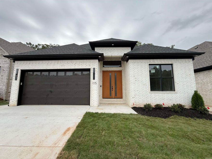 Welcome to Kinley Ridge, one of the newest Chenal communities! This stunning home is within walking distance to the new community POOL and PARK opening up Summer 2026! Step into style in this beautifully designed two story home. Downstairs the spacious kitchen is the star of the show. It showcases custom cabinetry to the ceilings, high end appliances, and ample countertop space. The kitchen overlooks an open living area with an extra large sliding door opening up to a private covered patio. You'll also find 2 bedrooms with their own en-suite bathrooms, a half bath for guests, and a beautifully functional laundry room on the main level. Upstairs you're welcomed by a large landing area, perfect for a playroom, media room, or secondary living area. You'll find 2 more bedrooms and a full bathroom, as well as attic access for extra storage space. This home is almost complete, please pardon our progress as finishing touches go in to create a truly unique and inviting space!