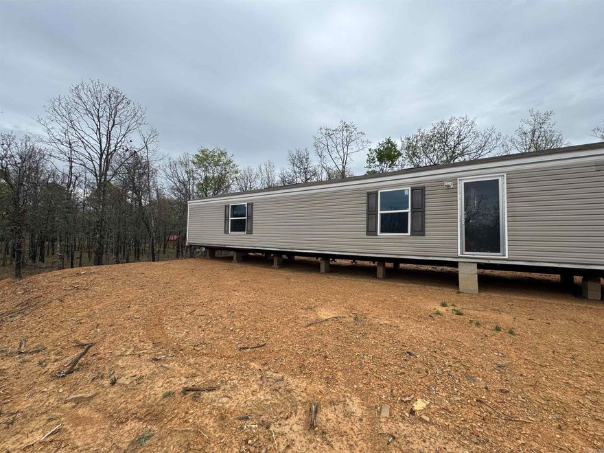 3 bed, 2 bath mobile home on 3 acres with plenty of space and privacy. Not on a permanent foundation, so it will not qualify for traditional financing—cash only. Solid opportunity for someone looking for land with a home already in place, whether for personal use or investment. SEE AGENT REMARKS.
