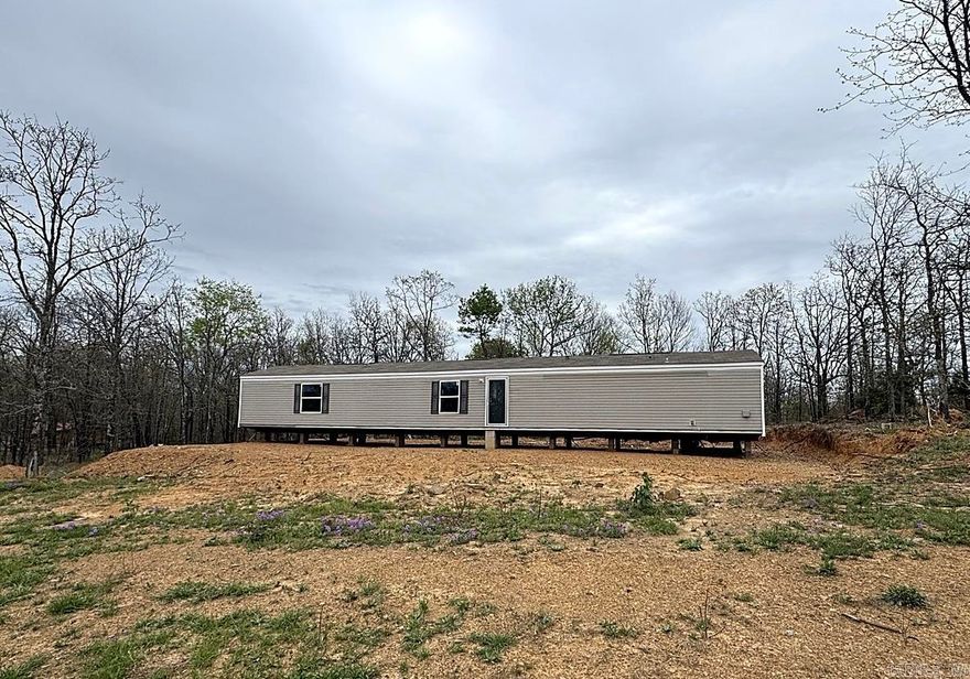 3 bed, 2 bath mobile home on 3 acres with plenty of space and privacy. Not on a permanent foundation, so it will not qualify for traditional financing—cash only. Solid opportunity for someone looking for land with a home already in place, whether for personal use or investment. SEE AGENT REMARKS.