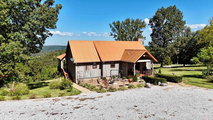Spacious Home & Guest House with Breathtaking Ozark Mountain Views! The main home welcomes you with an open floor plan, vaulted wood ceilings, and a spacious kitchen that flows into the dining area surrounded by oversized windows. The main-floor master suite includes a full bath and walk-in closet. Downstairs, the walk-out basement offers two additional bedrooms, a full bath, a large shared walk-in closet, utility room, and a safe room. The guest house, currently operating as a nightly rental, is designed for comfort and entertainment with a generous bedroom, expansive living area, full kitchen, full bath, and a second bedroom or office. Above the guest house is a large storage room! Outdoor living is a highlight, featuring a screened-in porch, large deck, and private firepit area. The guest house comes furnished minus a few items! Additional features include a 42x24 carport/barn with fenced in area, tons of landscaping, whole house generator, new roof, new HVAC system, & more! Located near the White River, National Forest, & Downtown Mountain View!