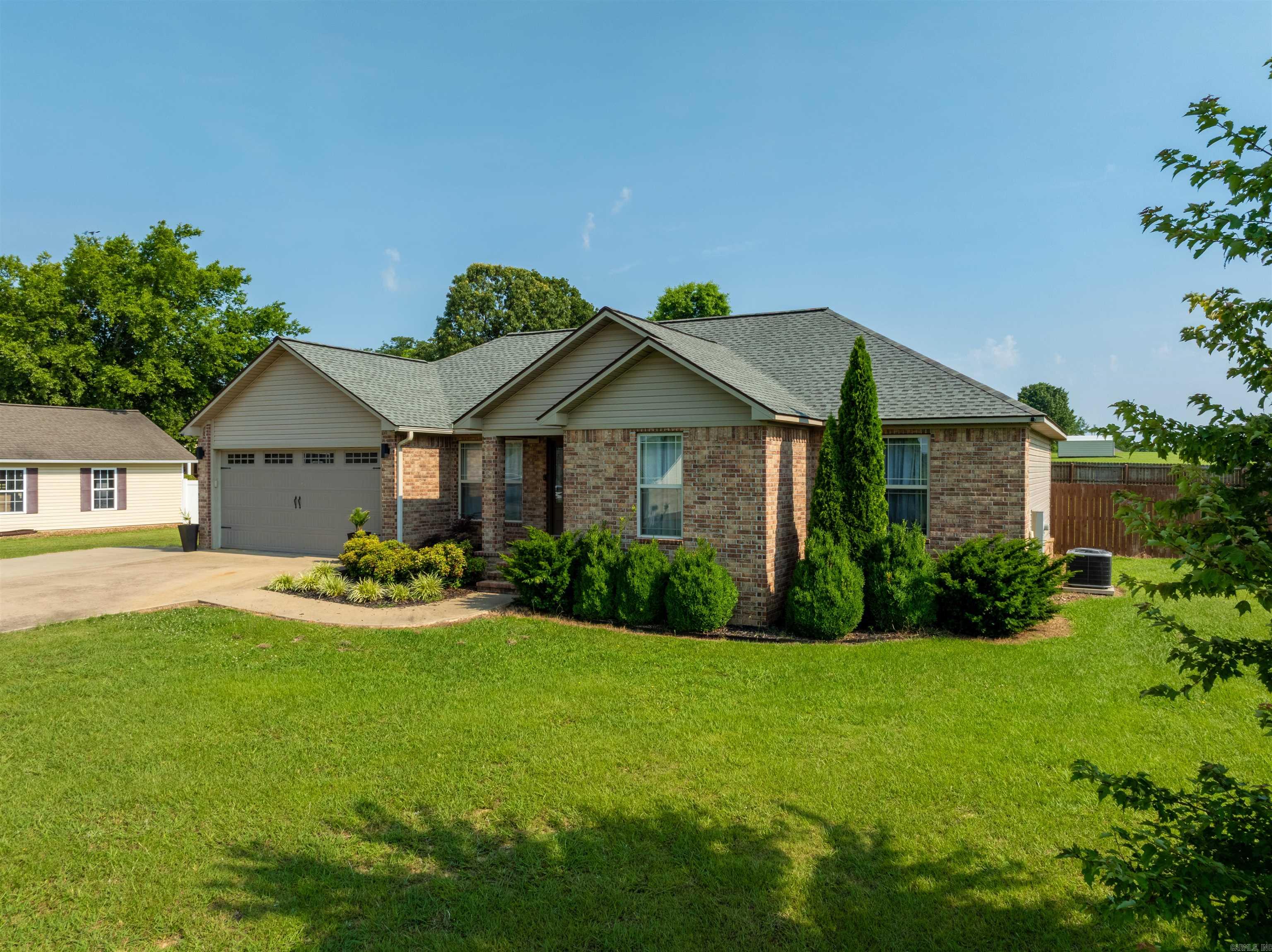 Charming 3 Bedroom, 2 Bath Home in Double Oak Estates – Cave City, AR Welcome to the Patterson Addition of Double Oak Subdivision—one of Cave City’s most desirable neighborhoods! This well-maintained 3 bedroom, 2 bath brick-front home offers approximately 1,608 sq ft of thoughtfully designed living space and a privacy-fenced backyard. Step inside to a spacious living room highlighted by a tray ceiling and natural light. The kitchen offers plenty of room for a dining table, along with a window overlooking the backyard—perfect for family meals or entertaining. The primary suite also features a tray ceiling for added charm, with generous closet space and a comfortable layout. Additional highlights include: Concrete patio for grilling and outdoor gatherings Laundry room with built-in shelving and garage access Flexible third bedroom ideal for guests, a home office, or nursery (not pictured due to storage use) Enjoy the quiet, walkable streets of Double Oak Estates along with access to a private neighborhood lake for fishing and relaxation. Conveniently located just minutes from Main Street, local parks, schools, dining, and more. This home combines comfort, location, and community!