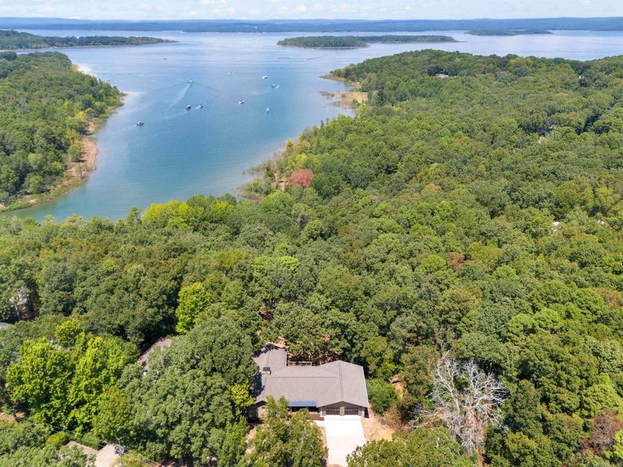 Incredible Greers Ferry Lakefront home remodeled by Hurd Custom Homes. The attention to detail speaks to the quality of workmanship and thought that went into bringing this 1987 home up to meet the needs of modern living in 2025. Open concept living space on the main level of the home speaks to easy living and entertaining. Native stone fireplace, vaulted ceiling, and wall of glass leading to a large covered deck overlooking the backyard firepit and lake. Walkout basement level boasting a Den, a bonus room, and 3 Bedrooms. The master suite is located on the main level. Plenty of room for family & friends in this 3836 SF lake home. 31 x 36.9 dream garage for all your lake toys. Heber Springs Marina, Red Apple Country Club/Golf Course & Eden Isle Marina a short drive away. SEE ASSOCIATED DOCUMENTS for larger floor plan and detailed information.