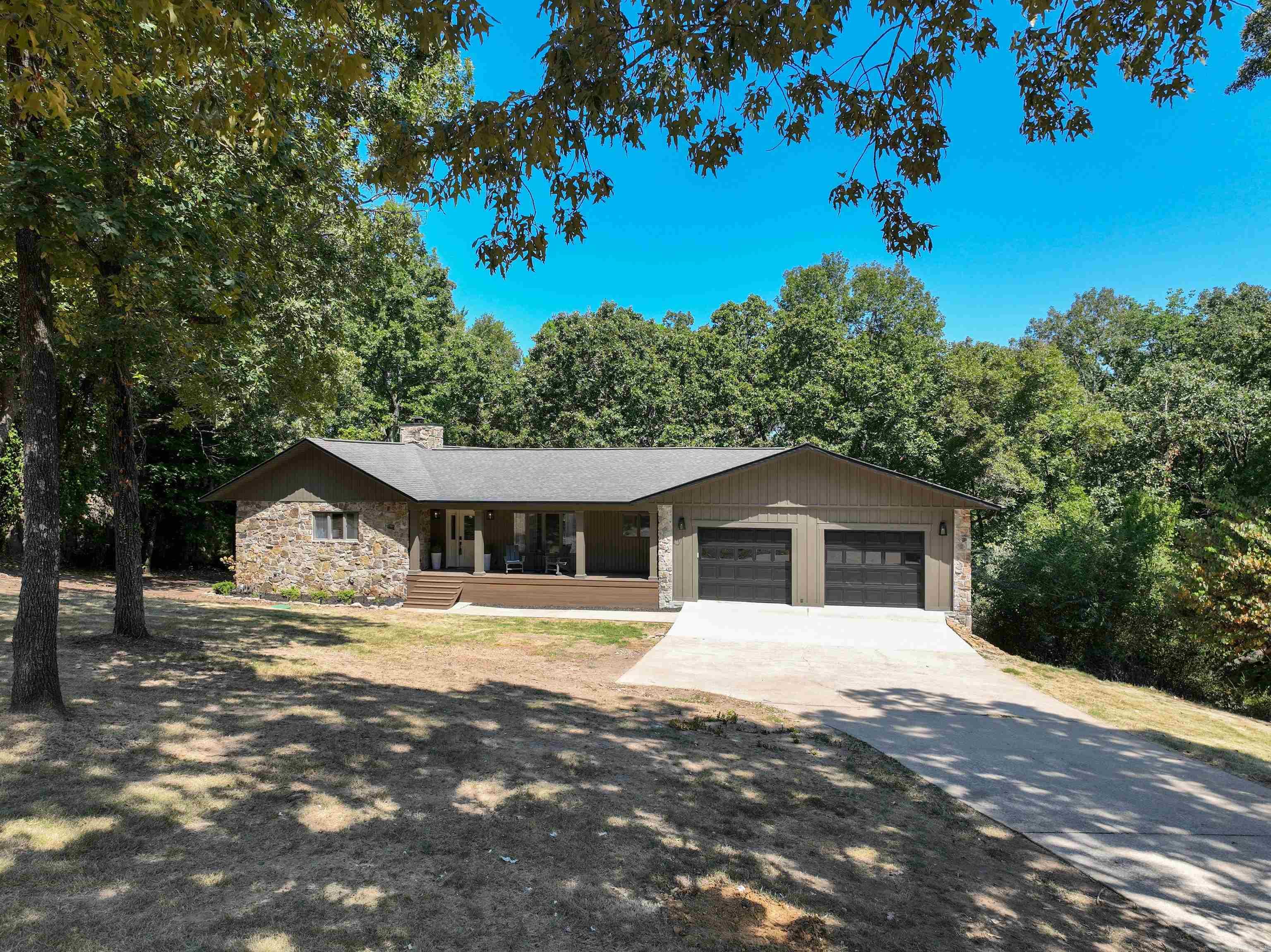 Incredible Greers Ferry Lakefront home remodeled by Hurd Custom Homes. The attention to detail speaks to the quality of workmanship and thought that went into bringing this 1987 home up to meet the needs of modern living in 2025. Open concept living space on the main level of the home speaks to easy living and entertaining. Native stone fireplace, vaulted ceiling, and wall of glass leading to a large covered deck overlooking the backyard firepit and lake. Walkout basement level boasting a Den, a bonus room, and 3 Bedrooms. The master suite is located on the main level. Plenty of room for family & friends in this 3836 SF lake home. 32 x 36 dream garage for all your lake toys. SEE ASSOCIATED DOCUMENTS for larger floor plan and detailed information