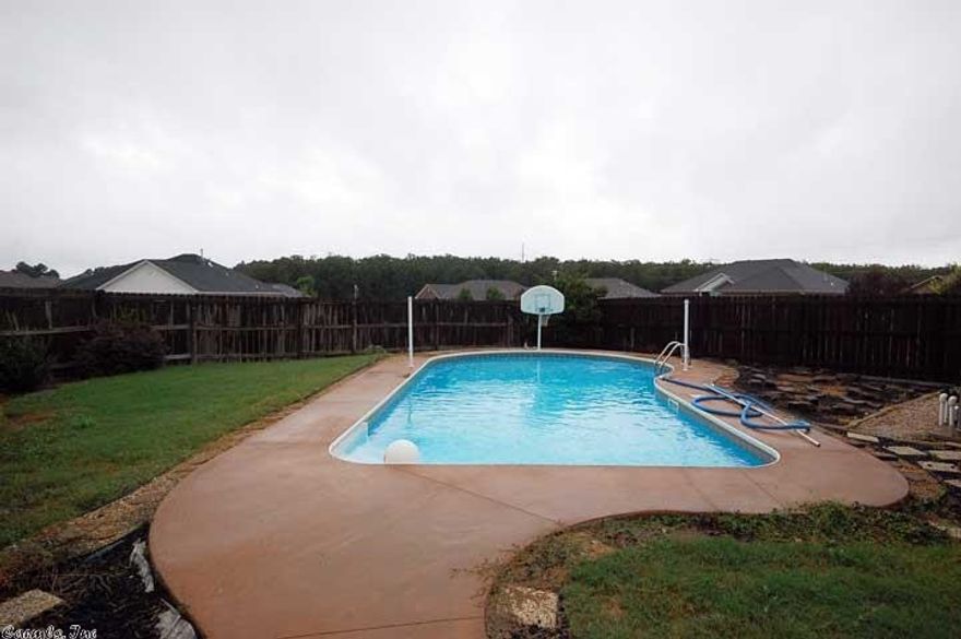 INGROUND POOL! NEW PAINT IN ENTIRE HOUSE, NEW LAMINATE HARDWOOD INSTALLED IN LIVING RM, DINING, AND HALLWAY as of 7-1-15. THIS HOME IS A MUST SEE. OPEN FLOOR PLAN, VERY SPACIOUS, SPLIT, GAS LOG FIREPLACE WITH WRAP-AROUND BUILT IN CABINETS, 9 FT CEILINGS,TILE IN WET AREAS, WINDOW COVERINGS CONVEY, 2" BLINDS, MASTER SUITE HAS HIS AND HER CLOSETS PLUS OVERSIZED TUB/SHOWER, COVERED FRONT PORCH, CORNER LOT WITH SIDE ENTRY GARAGE, FENCED IN YARD. NICE LANDSCAPING IN FRONT AND BACK YARD.