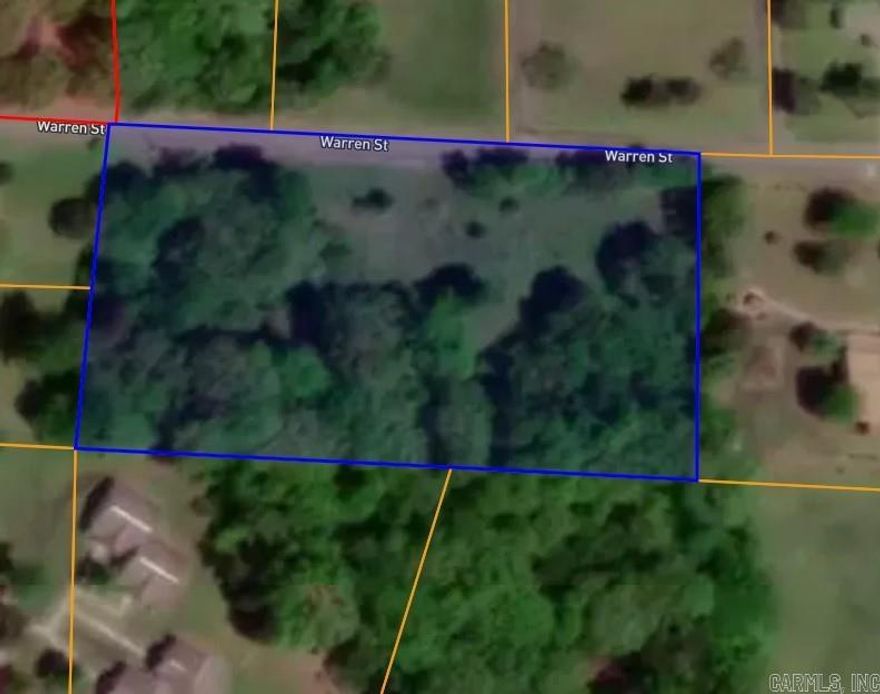This beautiful wooded 2 acres, located in city with nice view of mountains, city utilities available, lays good. Build your dream home or invest in this nice property.