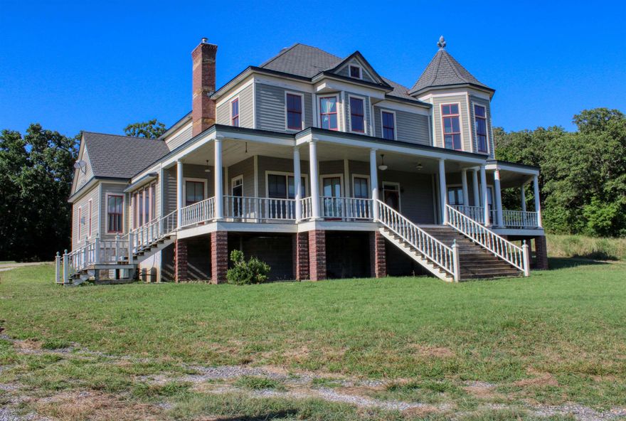 Step back in time with this Victorian Style Home! This gorgeous home has views for miles and is sitting on 6.33 acres m/l of pure bliss. Located at the end of its own private drive and over looking the beauty of the Ozarks! Outside you will find plenty of fresh Mountain air, a covered wrap around deck, a detached garage and 4 car covered parking under the carport. Inside you will be please with the tastefully and well thought out designs throughout the home, gorgeous custom hand milled wood floors, impressive wood work and high ceilings. Primary bedroom has its own private bathroom and safe room. This home shows great attention to detail and is sure to leave you screaming with excitement! Located a short distance from the World-Famous Buffalo River! Buyer to verify all information about property.