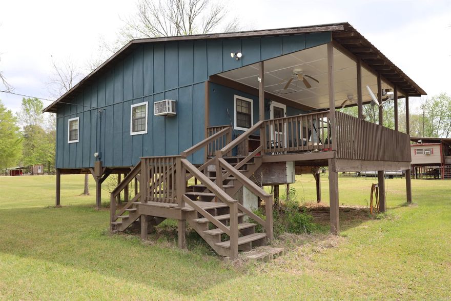 Escape to the peaceful outdoors with this charming 2 bedroom, 1.5 bath camp house located right on the banks of the Ouachita River. Just 3 miles from Moro Bay State Park, this property is perfect for weekend getaways, fishing trips, or a relaxing retreat.  Situated at 218 Mitcham Landing Rd, Lot 14, this cozy cottage offers approximately 768 square feet of comfortable living space. featuring, 2 bedrooms, 1 full bath + 1 half bath. Riverfront location with beautiful natural surroundings, Metal roof for durability and low maintenance, Updated PEX plumbing.  Being sold fully furnished, including new beds, refrigerator, Stove, Washer/dryer combo, and recliners. Whether you're looking for a personal getaway or an investment property, this riverfront camp is ready to enjoy form day one!