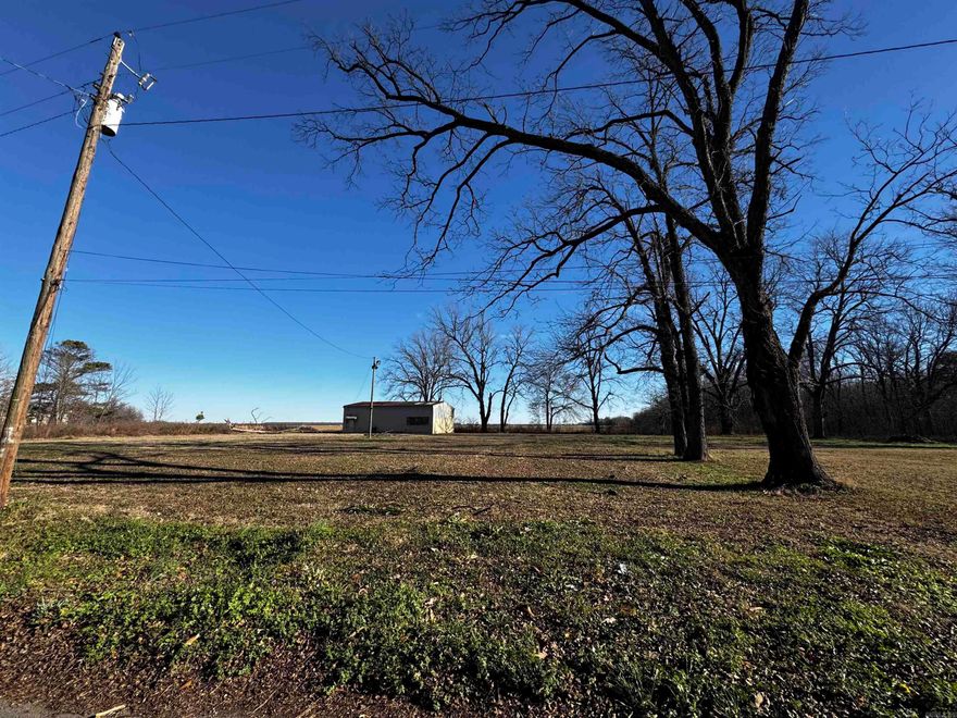Level, cleared acreage with a 40x40 Shop. No restrictions. Electric and water on property. Three driveways to property.  Lots of potential! Homestead, duck hunting club, RV park..  Call today for a showing!