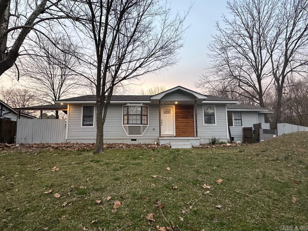 Owner is in the process of finishing up a few final touches. Updates throughout including a new deck, roof, plumbing, electrical, heat/air unit, flooring, paint, fixtures, french doors, a beautiful custom shower and kitchen island. The kitchen and all three bathrooms have been completely remodeled. The sunroom has french doors leading out to the deck that could be used as an office or den. The bonus room/4th bedroom has original hardwoods and will have a small closet added. Lots of space for a large family. The trim throughout and the beam in the living room are both from a home that survived the 1953 tornado. The seller is very motivated and is offering $1500 to buy down the interest rate, new appliances or upgrades.