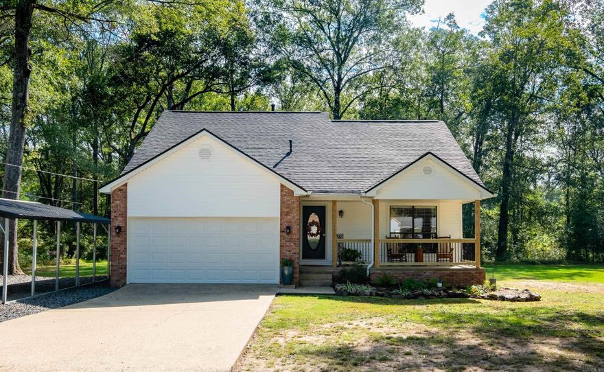 Beautiful home on 1 acre! Privacy & plenty of room to roam, lots of parking for cars, RVs, ATVs, etc..! The land is level & tree filled, in a very quiet spot. This home is so pretty with new siding (2024), gutter guards (2022) & roof (2024) PLUS brand new columns & rails on the front porch! Additional carport added (2022). Inside features updated floors throughout, very tall vaulted ceiling in the living room w/ fireplace (gas logs), pretty dining area open to kitchen w/ quartz counters, breakfast bar, stainless steel appliances. Back door leads to a fabulous newly built screened-in deck w/ tall ceilings, fan & door to cute walkway. All overlooking the woods - very serene. Primary suite has updated granite counters & tile/glass shower & on the main level, plus 2 other bedrooms & full updated bath upstairs. Closets are spacious w/ great storage and one BR up has access to attic. HVAC replaced (2020). Agent - see remarks.