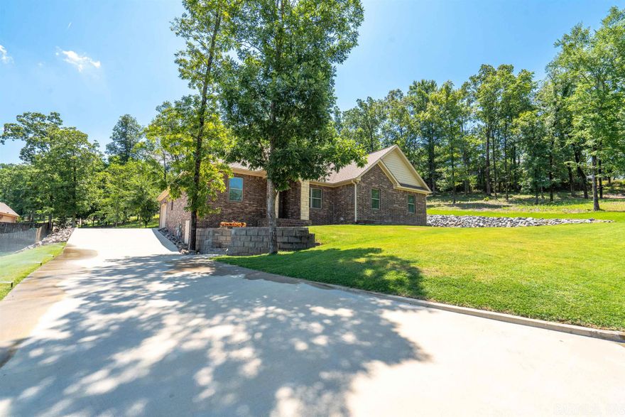 Nestled within a desirable neighborhood, this home comes with three additional lots offering tranquility and convenience. Easy commute to doctors/hospitals, shopping, schools, and recreational fun.  In the past two years, owners have added landscaping, a new sprinkler system,  epoxy flooring to the garage, and an encapsulation vapor barrier throughout the crawlspace. An open floor plan shows off crown molding, granite countertops, breakfast bar, great room w/fireplace, and office/bonus room. Separate primary suite boast of a walk-in closet tiled shower, soaker tub, and divided double vanities.  Upgraded stainless steel appliances. Oversized two-car garage. This home's location, the additional lots, and top-notch quality & features make it the perfect home. Schedule your appointment for a showing. Don't miss out!