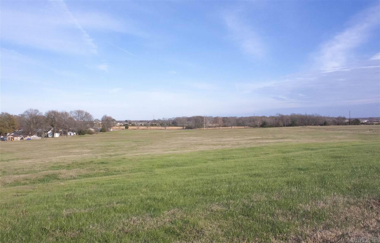 139 Acre cattle farm within the city limits, one of the most picturesque farms in and around Searcy, fenced and cross fenced, 2 large multi-functional livestock buildings, 2 barns, has excellent hay production, ready for any cattle operation, has 4,092 square foot home on the farm, sewer is located close to the property which may be obtainable, all other utilities available, currently zoned U-T, potential for residential or commercial development.