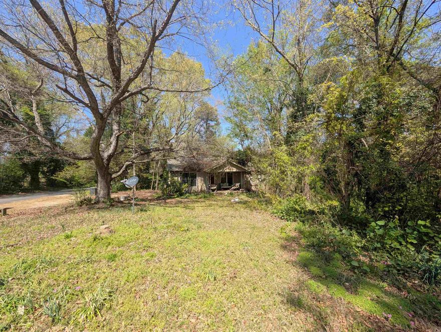 Investment opportunity in Benton! Large double lot near the interstate has loads of potential. Home still on property is not valued. Property being sold AS IS.  SEE AGENT REMARKS.