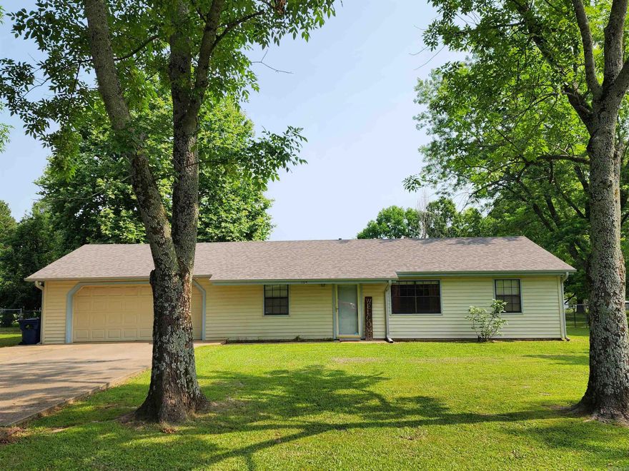 Very well built walk in home with no steps in a great family neighborhood.  3 bedroom 2 bath with large updated kitchen with new dishwasher. New roof with gutters, 2 car garage with huge storage room.  Washer and dryer convey in the laundry room that leads to the covered back patio with 2 porch swings, very sweet playhouse/garden shed, lawn mower storage building, fence all in a spacious level backyard. The home includes hardwoods, tile, and carpet. Home is both electric and natural gas with very reasonable monthly utility costs.  The street circles around to the next neighborhood where families walk and ride bikes around the block. Sq ftg is approx please measure.