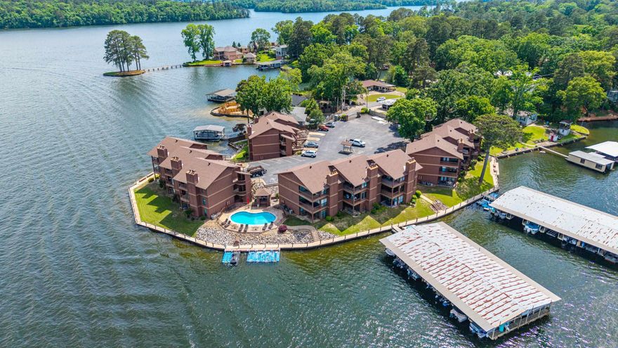 This stunning lakefront condo offers the perfect blend of convenience and relaxation with its sought-after walk-in entry. Step inside a fully furnished space where every detail has been handled, allowing you to start enjoying the water immediately. You can rest easy knowing the big-ticket items are updated, including a brand-new washer (2026) and a new HVAC system installed in 2023. Outside, your private jet ski pad provides instant access to lake adventures. The entire complex has been meticulously maintained, boasting recent upgrades like new roofs and sturdy modern staircases. You will especially love the resort-style atmosphere of the newly completed pool renovation, perfect for summer afternoons. Because short-term rentals are strictly prohibited, you are guaranteed a quiet, stable environment focused on peaceful year-round living. Best of all, you are just minutes away from local shopping, dining, and entertainment, putting you close to everything Hot Springs has to offer.