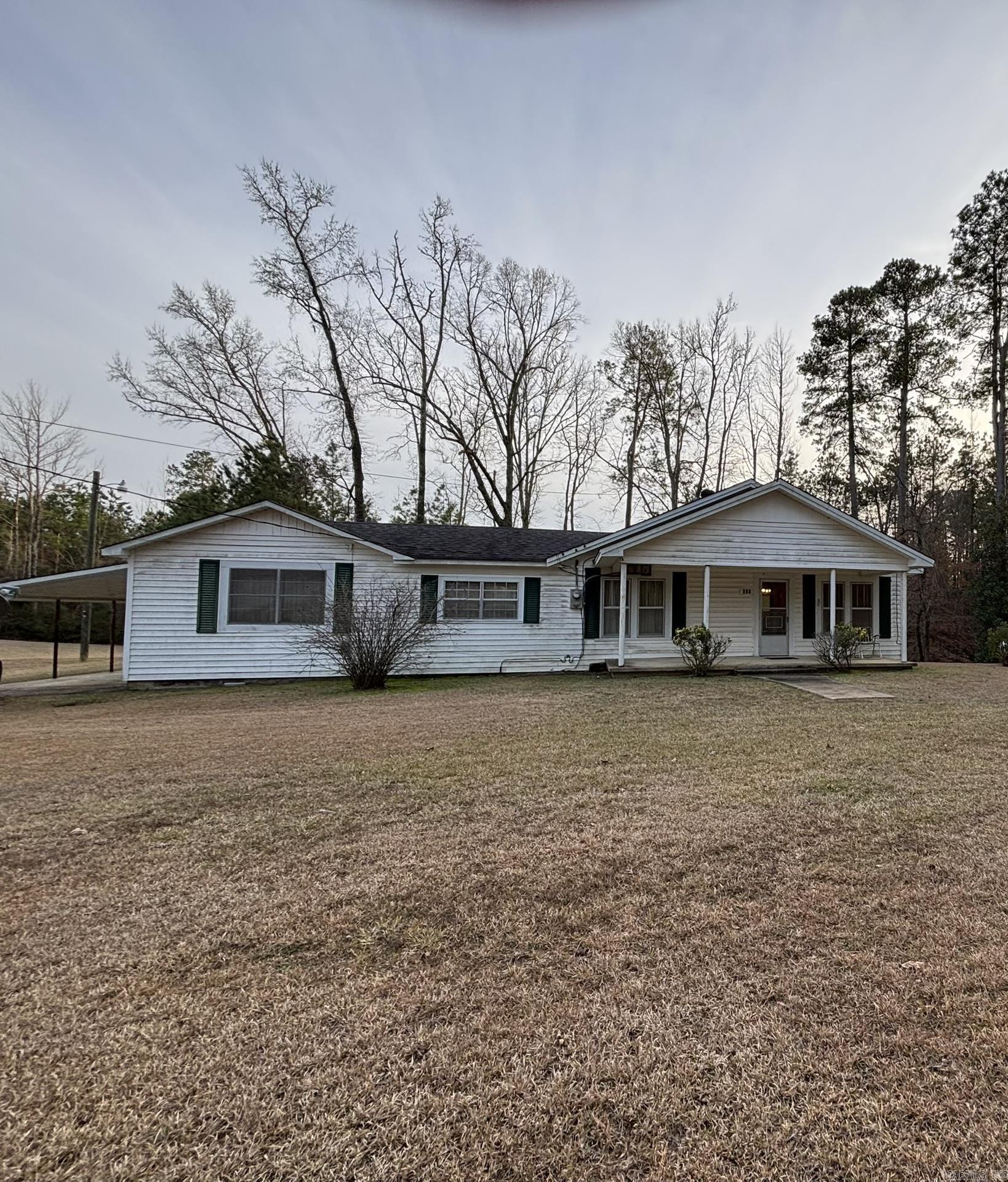 Cute 3BR/2BA home in a private country setting. Nestled on approximately 2 acres with a nice size eat-in kitchen, 2nd dining area, 2 living room areas, and 2nd kitchen area on the opposite end of the house, central heating & air new in 2023, fenced yard, new septic in 2025, cute front porch, and large laundry room with sink.