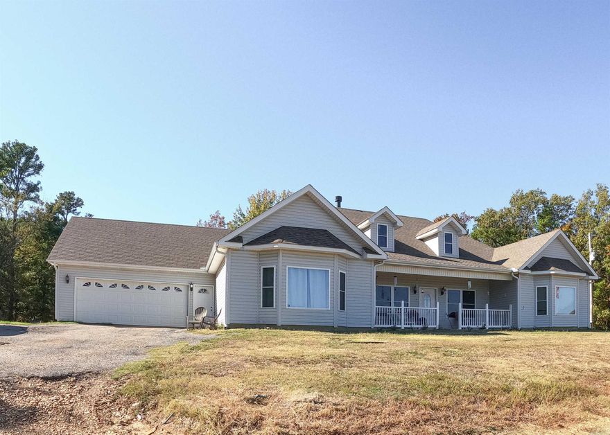 Nature lovers! Almost 85 beautiful rolling acres, with a spacious, 1-level, 3 bedroom, 2.5 baths, large great room with marble & granite fireplace, office, formal dining room, large kitchen with breakfast dining area plus breakfast bar, granite counters, dual ovens, electric cooktop, granite countertops, a lot of cabinet & counter space plus island and a large walk-in pantry. Large laundry room with worktop & cabinets. Primary bedroom suite is separate from the other 2 bedrooms. Primary features a large bedroom; big enough for a seating area with a view of the rolling hills plus 2 walk-in closets. Super-sized private bath with large jet-tub, dual vanities, linen closet and a walk-in, oversized shower. Saferoom/shelter in the house provides security plus additional storage space. Enclosed Sunporch with abundance of windows with screens plus a connecting all season’s room to enjoy the wildlife in comfort even when it’s freezing out. There is a large workshop with electric and other storage buildings plus a single wide mobile home (currently rented) with a separate driveway. This beautiful acreage includes woods, trails, pastures, stock pond and a view of below Crowley's Ridge