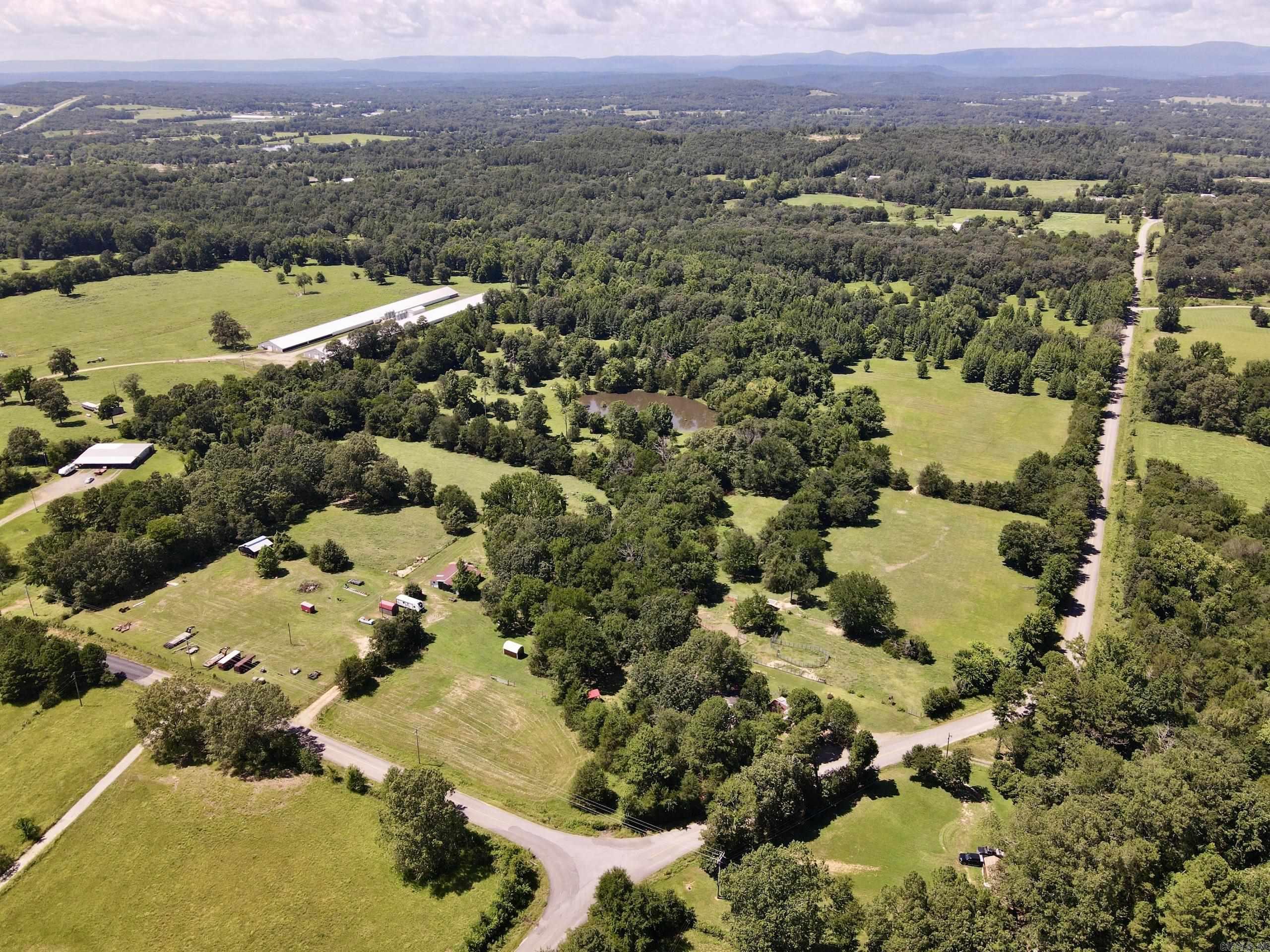 Located just minutes from Interstate 40 and Piney Bay, this family farm has been lovingly operated for two generations and is now ready for its next chapter. With county road frontage on two sides, this property offers both convenience and accessibility, whether you envision continuing its agricultural use or exploring its development potential. The land unfolds across gently rolling terrain, with a well-balanced mix of fertilized pastures and timbered areas.