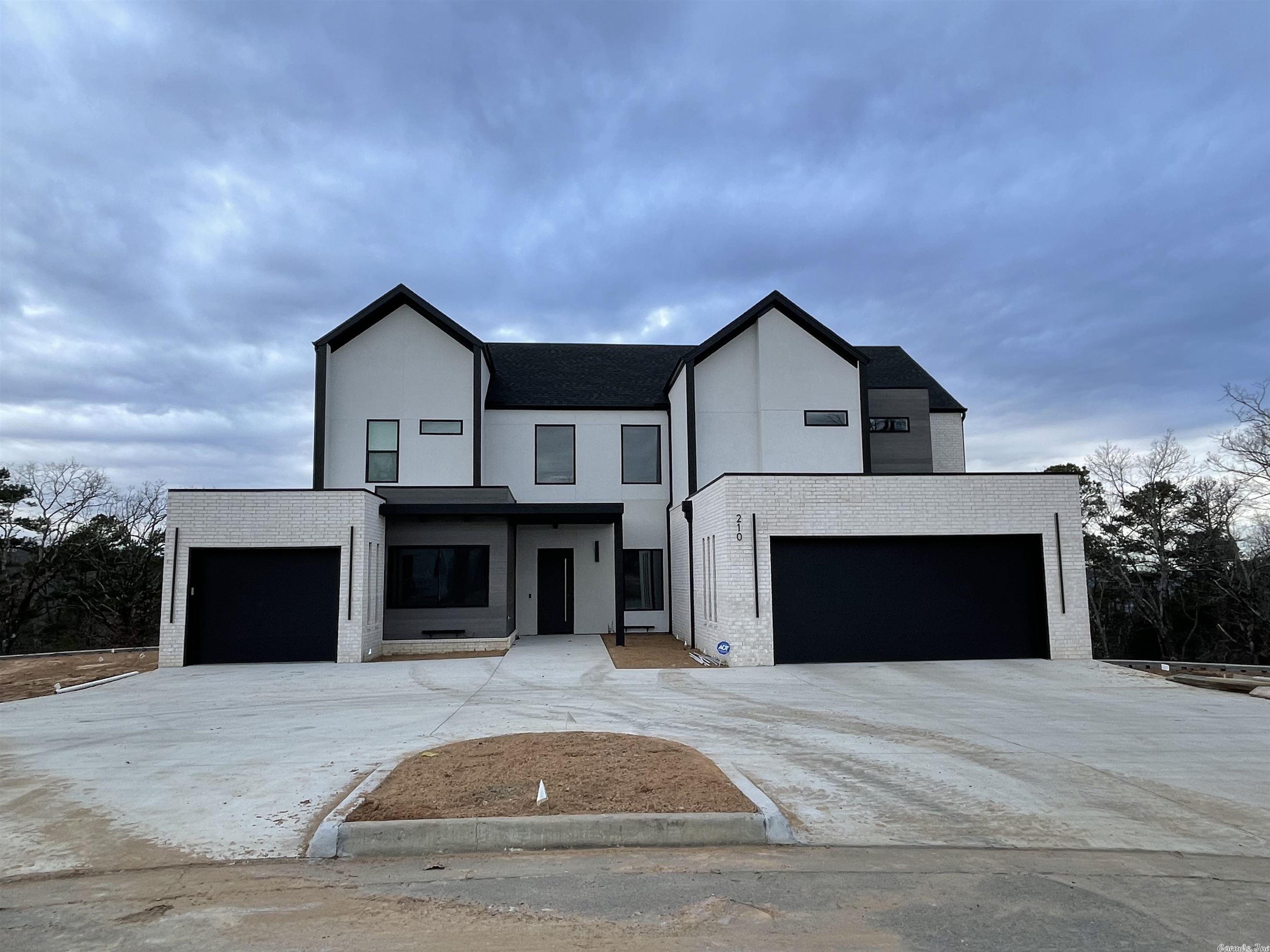 Stunning modern construction - From inviting entry see spectacular wall of windows overlooking green space. Greatroom w/horizonal fireplace trimmed in vertical wood. Open Concept w Fabulous kitchen w/quartz countertops, Induction cooktop, paneled refri w/add'l refrig drawer, dishwasher, double ovens & Lg island. Large walk-in pantry, Laundry rm w/sink, Office, Owners Suite & guest room on main level. Upstairs: 2 Bedrooms, 2.5 BA & Media Room. Deck overlooks greenbelt - Extensive landscaping with retaining walls.