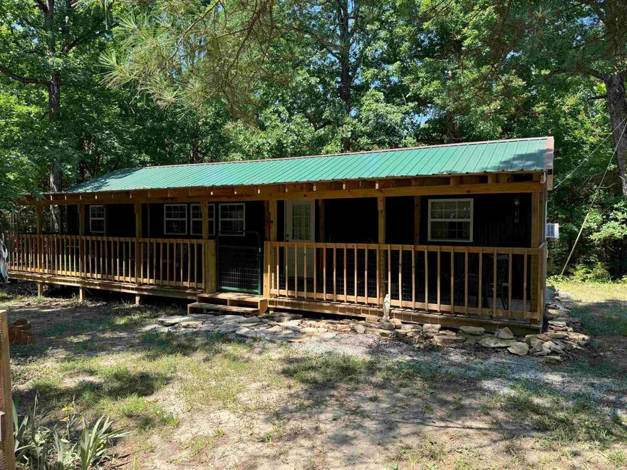 Country home with covered front porch located in Ravenden Arkansas, randolph county on +/- 15 acres. This house sits off of main road behind gates and is the perfect retirement or get a way vacation / hunting cabin. Mostly wooded acreage with large circle driveway coming into property. Clay county electric and high speed internet available with rural water. Property also has had another homeplace set up that has been torn down, but still has some utilities for a second home. Farm house cabin set up with additional insulation and wrap for energy efficiency. 2 bedroom 1 bathroom. open concept living room / kitchen. On demand water heater. front porch full length of home.