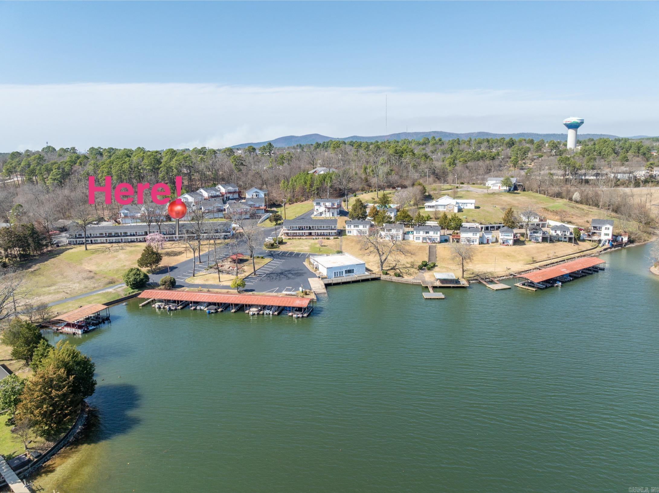 Maintenance-Free Lake Life! Rustic 2 bedroom, 2 bath condo on the lake, with all the amenities. This gated subdivision has so much to offer with boat dock, swimming pool, swimming dock, boat slip, pavilion, picnic area, clubhouse, boat ramp, and trailer parking. Great location off Central Ave, with shopping, eateries, and entertainment nearby. What a great get-away or just move-in and make it yours.
