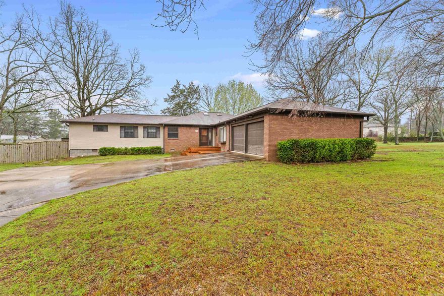 When the original owner of a house was an architect -- love and attention to detail went into THAT build! Still owned by the original family, this property is THE definition of multi-functional! To the naked eye it appears to just be a normal house on a massive near-acre lot in a stellar location. But look closer! This home has a full studio living area (with kitchen) on one end that could be used for an aging parent, in-law quarters, moody teenager hideaway, in-home nurse or au pair, stowaway place for a spouse who forgot to take out the trash or a rental income opportunity! The private fenced portion of the acre lot boasts a back yard for entertainers or gardeners, complete with multiple decks, patio, fire AND horseshoe pits, several raised garden beds and more! Nice Weber gas grill conveys, as well as huge outdoor storage shed. Extra lot on the side can be kept or partitioned off and sold. Slide in today and see this unique home! AGENTS SEE HELPFUL INFO IN REMARKS!