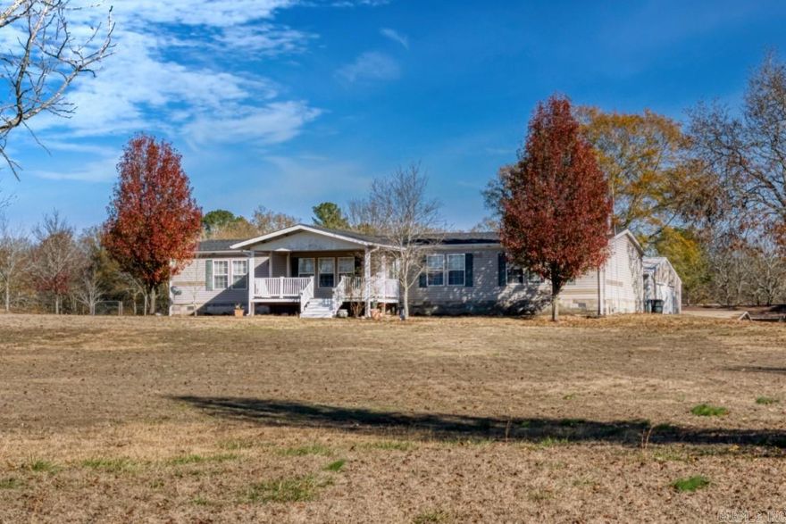 Welcome to your serene retreat in the heart of nature! This charming 4 bed, 2 bath home features generous 2 Living areas,  office, 2 ovens, large primary bedroom/bath with walk in tub and shower, large front and back porch. Home has a new roof installed in 2023 and a water softener. Has RV hookup and Generator hook up, along with 30x40 Shop including 3 bay doors lots of work areas and Tornado Shelter. Property also includes 16x24 shop and 2 other storage buildings.