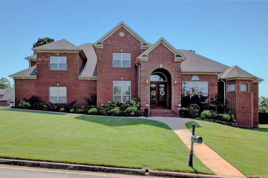 Beautiful two story, all brick home on corner lot in desirable Chenal Valley Epernay Place. Amazing plush yard w/landscaping leads to dbl glass/iron doors. The entry sequence is a defining moment to present the style & prepare visitors for what's to come in this masterfully executed home w/high ceiling & golden oak wood floors inlaid w/tile leads to executive office & formal dining rm. A gracious family room w/FP open to the kit. The gourmet kit is every Chef's dream w/granite countertops, breakfast bar, island, walk in pantry, SS appl, 5 burner gas cooktop, & dbl ovens. Kit dining area leads to covered patio & deck, fully fenced back yard w/basketball crt, & fresh veg garden w/irrigation system. Primary suite on main level offers privacy & seating area w/FP. The luxury spa ba w/sep dbl vanities, jetted tub, custom tiled walk-in shower, H/H toilets. Off the kit dining rm is dream laundry room, ½ bath, 3 car gar, & staircase. Upstairs game room/bonus/media room w/kitchenette & 1/2 bath. Guest BR & ensuite bathroom, 2 more guest bedrooms share a Jack/Jill bath. Upstairs could also be used as in law suite. New roof 2019, New AC Unit 2022, New Paint and Carpet 2018. Agent remarks!