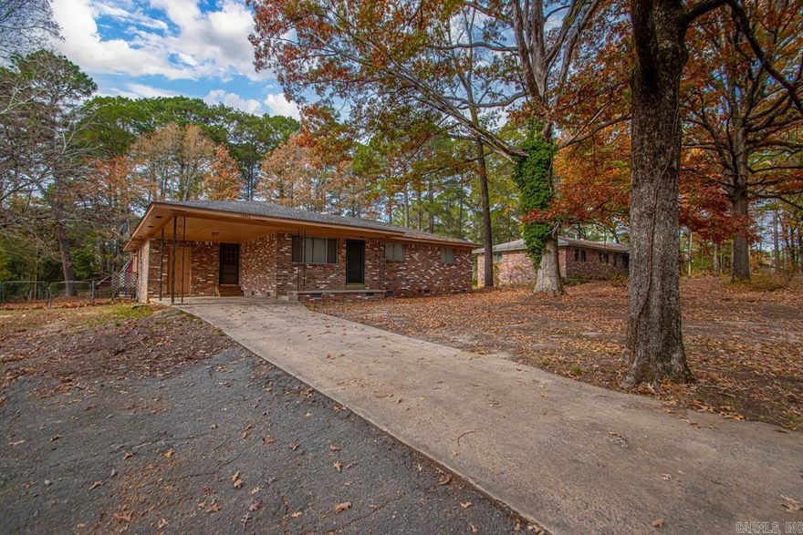 This gem located in the Shannon Hills area has so many updates. You will not want to miss out. 3 bedrooms with 2.5 bathrooms. Nice living room open to kitchen and dining area with a nice sliding glass door to go out back. Also, a nice den with walk in laundry area and full bath with large closet area. This den could also be used a 4th bedroom primary suite if desired. The home has newer paint, flooring, sub floor, fixtures, updated two bathrooms and kitchen. The back yard is fully fenced. Enjoy the 1 car carport for parking and also a nice SHOP out back to do your hobby or keep your toys. This home is all brick. Schedule your showing today!!