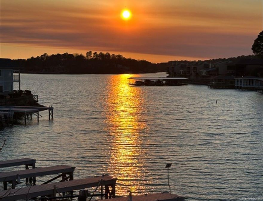 LAKE HAMILTON-LAKE FRONT HOME, 3BR- 3-1/2 BATH GATED HOME. JUST STEPS AWAY FROM YOUR PRIVATE BOAT DOCK.  THIS RARE HOME BOAST OF HIGH END AMENITIES, SWIMMING POOL, DOUBLE CAR GARAGE (NO DOOR) BOAT SLIP, TWO COVERED LARGE PORCHES, DUAL ENTRANCES (ONE LOWER BY GARAGE & ONE UPPER) SIT ON YOUR PORCH AND WATCH THE SUN SET OR BOATS ON THE MAIN CHANNEL.  AS YOU WALK IN THE UNIT FROM THE GARAGE YOU ENTER DEN/GAME ROOM, POWDER ROOM, WET BAR, LARGE BEDROOM & BATH - UPSTAIRS - GIANT LIVING /DINING WITH WET BAR & WINE COOLER-JUST OFF A GOURMET KITCHEN WITH GRANITE COUNTER TOPS, & STAINLESS STEEL APPLIANCES.  2- BEDROOMS UP (1) MASTER SUITE --EACH WITH THEIR OWN BATH--COME MAKE THIS YOUR NEXT LAKE HAMILTON HOME