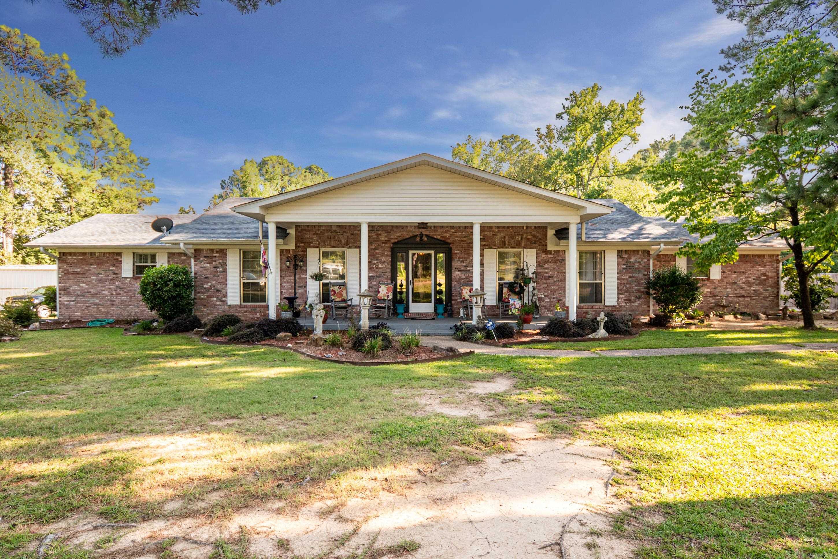 This well-maintained home sits on a beautifully landscaped .50-acre lot that offers space, comfort, and versatility. The property features a 30x30 shop with electricity, 2 roll up bay doors and a walk-thru door, 25x25 carport, covered patio, and attached covered parking. For peace of mind A new roof was installed last year and hvac is approx 4 years old. Inside you'll find 3 spacious bedrooms and 2 bathrooms. The open airy kitchen boasts stunning granite countertops, a large island with seating, quality appliances, a pantry, and abundant cabinet storage- all overlooking the dining area. The inviting family room is highlighted by a cozy brick wood burning fireplace with direct access to the side covered patio. A formal living room welcomes you from the foyer, perfect extra sitting but still conveniently located off the kitchen as well. For extra flexibility, this home also includes a bonus room-ideal as a playroom, media room, or man cave-plus there is a dedicated flex space off of hallway that makes a perfect home office. Endless possibilities to fit your lifestyle.
