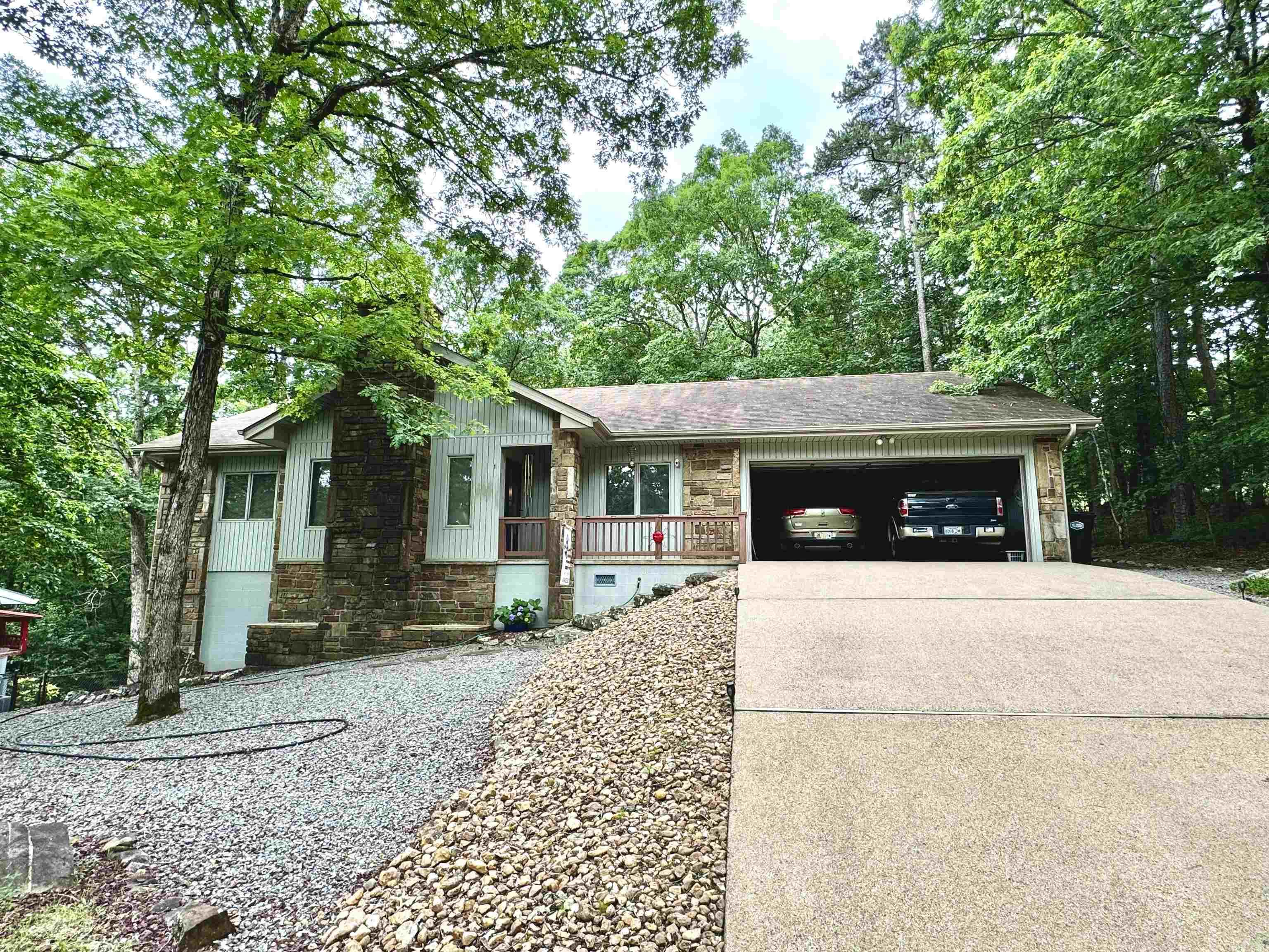 Welcome to 1 Sierra Drive, a charming 3-bedroom, 2-bathroom home nestled in the peaceful community of Hot Springs Village, AR. This inviting retreat offers a low-maintenance yard, breathtaking views, and a thoughtfully designed living space that blends comfort with convenience. Situated just 1,000 feet from Lake DeSoto, this home provides scenic lake views and easy access to outdoor recreation. Enjoy the added peace of mind with a full tornado shelter/basement, offering ample storage and versatility. Whether you're looking for a serene getaway or a permanent residence, this home is the perfect place to relax and unwind. Don't miss your chance to own this beautiful property—schedule a showing today!