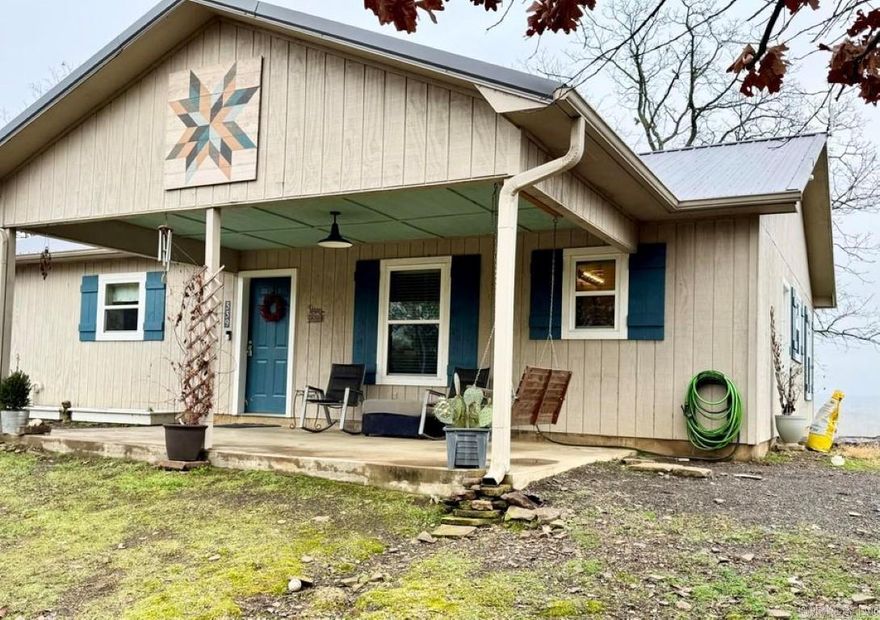 ESCAPE the daily stresses and enjoy the extraordinary views and peaceful sounds from this charming 2-bedroom, 1-bath home located on Perry Bluff, overlooking Piney Bay. Set on a spacious 2.4-acre lot and surrounded by an additional 20 acres, you'll find it hard to leave this recently updated property. Notable features include a 40-yearsteel roof installed in 2019, thermal glass windows also added in 2019, and an Ox Box SEER 2 heat pump installed in August 2023. The open-concept kitchen and living area provide sweeping views of the water and wildlife, while the energy-efficient electric fireplace keeps the home warm during the winter months. This opportunity won't last long, so be sure to schedule your personal tour today!