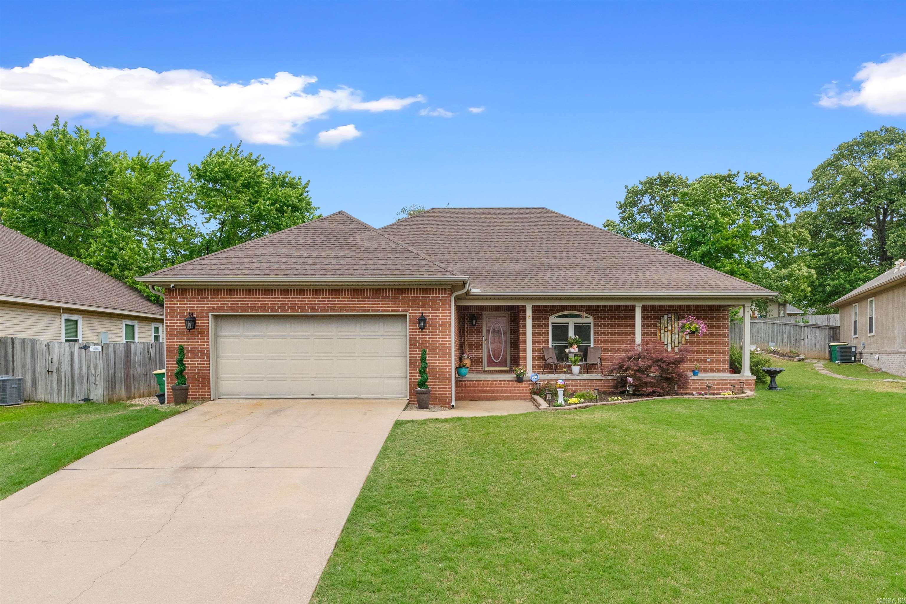 So many updates in this 3 BR, 2 bath home in Sherwood. Split BR plan with primary BR on one side of the home with a luxury bath that has tub and walk-in shower. Other 2 bedrooms are on the other side of the home along with another full bath. Greatroom has high ceiling, fireplace and plenty of room for everyone. The kitchen has new stainless steel appliances and lots of cabinets with granite countertops and leads into the laundry room. Some updates include roof, all new flooring, windows, AC, water heater and appliances 2023. Also a 7x10 building in 2023. A door leading from the greatroom leads to a gorgeous 16x40 deck with lighting - perfect for outdoor entertaining. Great neighborhood that's convenient to shopping, interstate and restaurants. AT&T Internet, ADT security system. This home has been meticulously maintained and is move in ready. Agents see remarks.