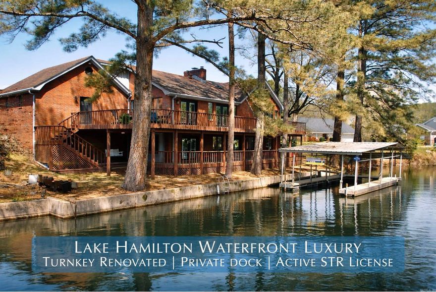 Welcome to an exceptional waterfront opportunity on Lake Hamilton - a fully updated 5-bedroom, 3.5-bath residence with an active short-term rental (STR) license in place, offering immediate income potential from day one. Ideally situated on a quiet cul-de-sac in one of Hot Springs’ most desirable lakefront communities, this property seamlessly blends luxury living with proven investment capability.  Spanning approximately 3,416 square feet, the home has been thoughtfully renovated to deliver a clean, modern, and completely move-in-ready experience. Recent upgrades include all new flooring, fresh interior and exterior paint, updated interior and exterior lighting, and elegant granite countertops throughout the kitchen and bathrooms. The kitchen is further enhanced with new appliances and refined finishes, while the bathrooms feature updated glass-enclosed showers, adding a polished, upscale feel.  What truly sets this property apart is its rare combination of an active STR license and transferable covered boat dock—a highly sought-after pairing on Lake Hamilton that positions this home for both strong rental demand and long-term value. The spacious, well-designed layout comfortably