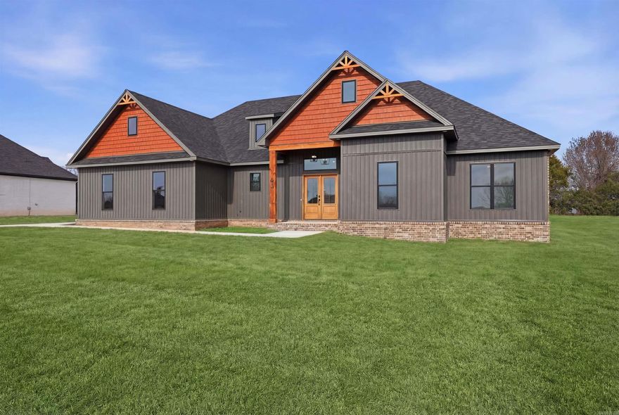 Welcome to your dream lake home retreat—new construction with premium materials and refined finishes, tucked inside an exclusive gated community! Located ~10 minutes from Shiloh Marina on Greers Ferry Lake, this 4 bed, 2.5 bath home offers nearly 2,400 sq ft of stylish and functional living space. Enjoy custom cabinets, granite countertops, a double oven, and durable LVP flooring throughout. The spacious living area features an electric log fireplace, perfect for cozy evenings.  Step out back to a large covered patio with a gas hookup—ideal for grilling and entertaining. Energy-efficient upgrades include a gas tankless hot water heater, radiant barrier roof sheathing (keeping the attic ~30° cooler than standard roofing materials), and Class 3 impact shingles, which offer added durability during high winds & hail as well as insurance savings.  Set in a gated neighborhood with a private boat launch, this home combines comfort, quality, and lake living at its best! Schedule a showing soon & be the first to own this stunning home!