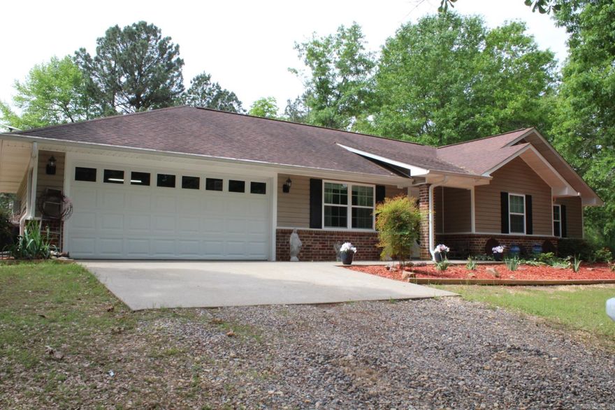 3 Bedrooms, 2 full baths with approx. 1556 Sq. Ft. of living space situated on approx. 2 acres of country living. Central A/C & Heat.  2 car attached garage.  Range ,Microwave, Refrigerator and Washer & Dryer conveys with sell of home.  Home has a 12 x20 Covered Patio , fruit trees and various berry plants.