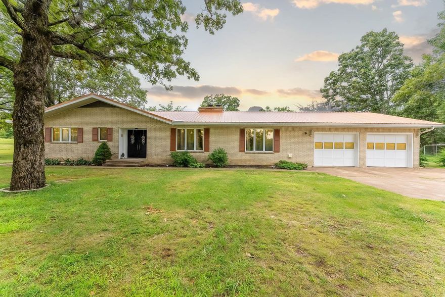 OZARKS COUNTRY HOME, SHOP, AND 15 ACRES FOR SALE NEAR SALEM ARKANSAS. Property is located at 6005 Hwy 9 S, Salem, AR. This country home has a beautiful hillside park-like setting. The home has approximately 1,682 sq. ft. of living area. Also included is a full basement. The home features central heat & air, carpet & vinyl flooring, wood fireplace, range, refrigerator, freezer, & a dishwasher. Basement appliances include a range & refrigerator. A two car garage, private well, septic system, & a 250 gallon propane tank are also included. A 30x50 shop building is located on the property for your workshop & hobbies. It is equipped with electricity & has a concrete floor. There are several large shade trees around the home, including a large garden area with fruit trees. Great location-minutes away from Salem. Lake Norfork, Spring River, and the world famous White River are approx. 30-45 minutes away. This would be a great property for a small hobby farm. The real estate taxes for last year were $886.75.