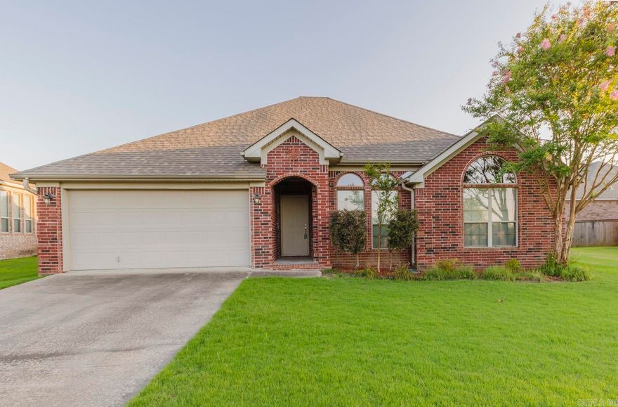 Gorgeous home located just 5 minutes away from LRAFB. Recently updated with new hardwood floors! Spacious living room features a tray ceiling and cozy fireplace. The kitchen boasts dark cabinets, ample counter space, a large breakfast bar, and stainless steel appliances. The generous master bedroom includes a tray ceiling, double vanity, jetted tub, and separate shower. Enjoy outdoor gatherings on the large new deck in the fully fenced yard.