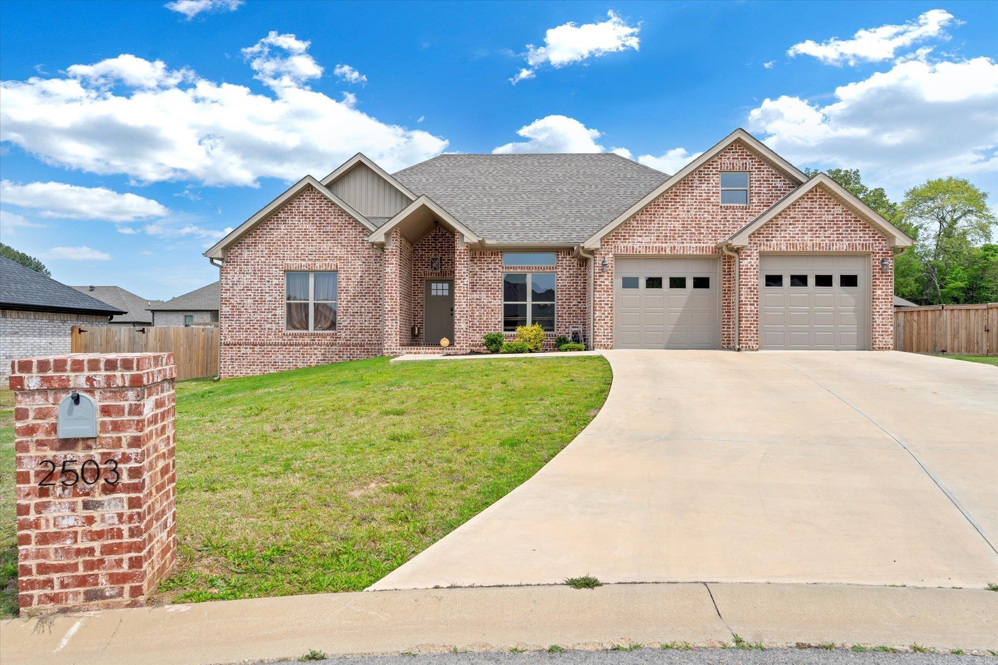 ASSUMABLE LOAN OPTION WITH THIS HOME! Ask how you can get an unheard-of interest rate! Welcome to your dream home! This property boasts three bedrooms and two bathrooms, featuring luxury vinyl plank flooring throughout. Relax in the elegant primary bedroom accented with a tray ceiling, two walk-in closets, and a lavish ensuite complete with dual sinks, a free-standing tub, and a tile walk-in shower. You can enjoy the convenience of a laundry room with shelves and cabinets, stainless appliances in the kitchen, and granite countertops throughout. Cozy up by the gas fireplace under the vaulted ceiling in the main living area. There are lots of windows that allow lots of natural light. Step outside to a partially fenced backyard, gutters, and a covered patio perfect for entertaining! This home offers comfort and style at every turn. Give your favorite REALTOR a call today to schedule your private showing.