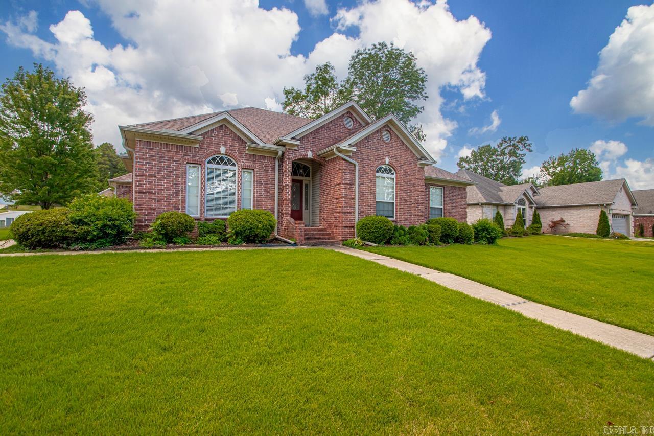 A beautifully maintained one level brick home in Country Club of Arkansas. Situated on a corner lot with a wonderful yard, this home is completely move-in ready. Offering three bedrooms, two living spaces, a formal dining room and a large screened in porch, there is ample room for entertaining or unwinding. Three car garage plus new roof, new paint, new fence, this home has it all.