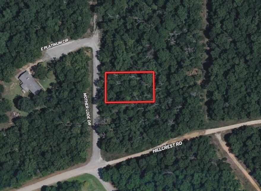 Build your private sanctuary: Wooded 0.32 acre m/l lot with walk-out potential. Escape the noise and bring your architectural vision to life on this beautiful .32 acre lot. Tucked away in a quiet, secluded pocket, this property offers the perfect blend of mature timber and serenity. The natural downslope of the land is a builder's dream, perfectly suited for a custom walk-out basement design. Imagine a lower-level recreation room or guest suite that opens directly onto a private patio shaded by a canopy of trees. Size: 0.32 acre m/l Topography: Downslope (Ideal for daylight/walk-out basement) Setting: Secluded, wooded, and tranquil Location: Horseshoe Bend, Arkansas Don't settle for a cookie-cutter flat lot. Build a home that rises with the landscape. Your woodland retreat starts here. Limited warranty deed-will need a state approved perc test prior to building.
