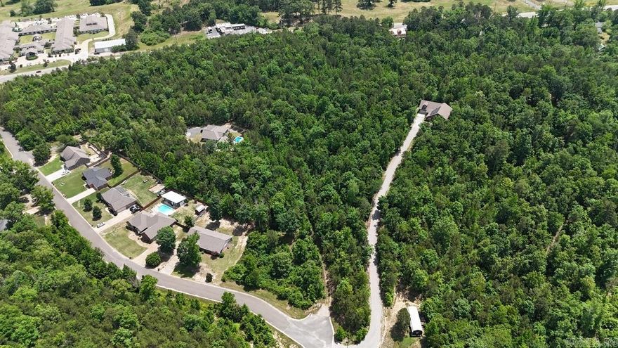 Beautiful 9.56 Acres MOL with access from Park Ave and Oak Creek.  Attention builders-develop a new neighborhood. Sell off the timber and build your dream house. Utilities are at the street.  Just 2.6 miles from the Hwy 5/7 round-a-bout and only 3.5 miles to Central Ave.  So many opportunities in this location!