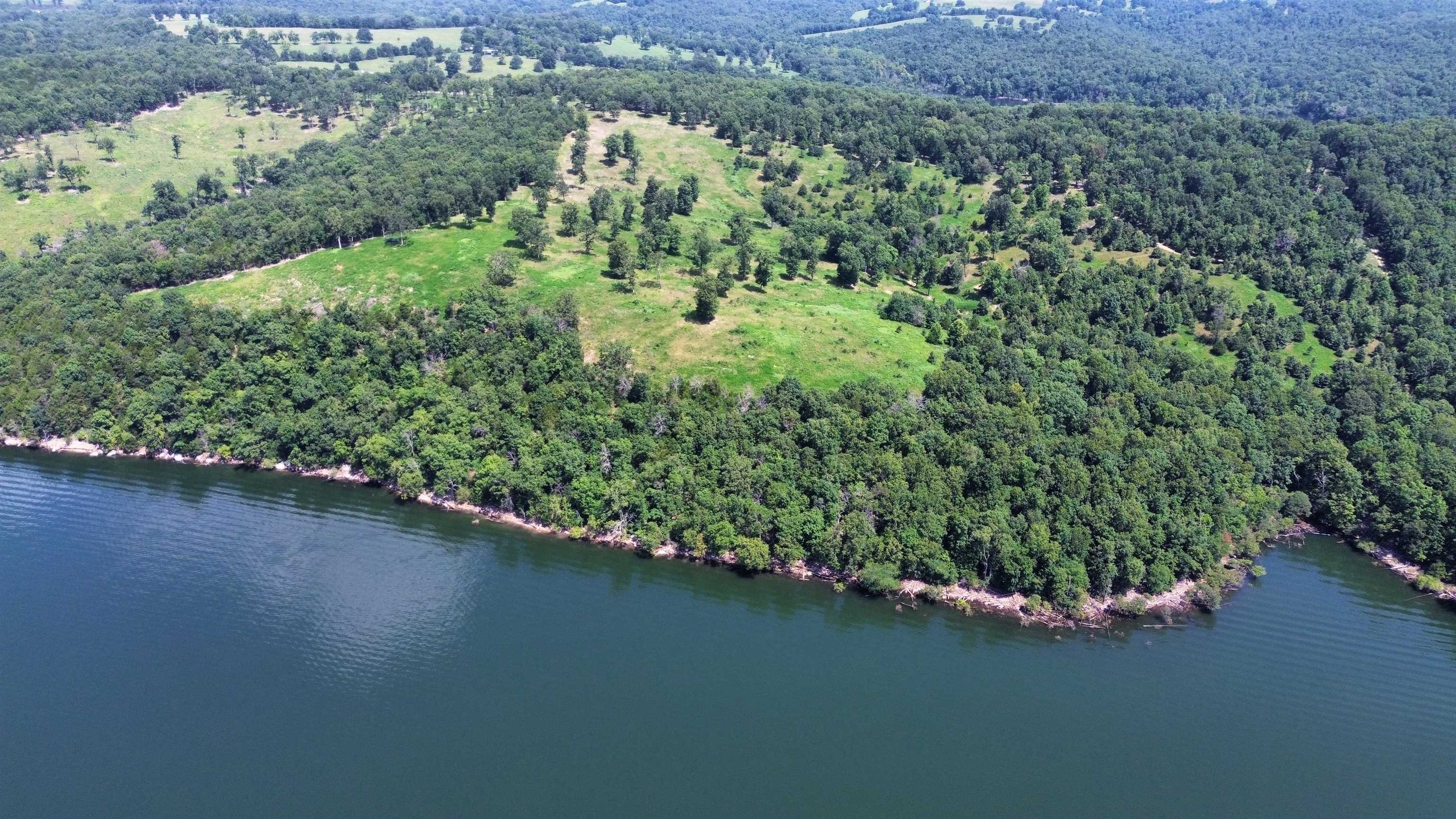 This is a rare opportunity to own a premier 120-acre lakefront property, nestled in the scenic Clark's Ridge area, just northwest of Mountain Home, Arkansas. Located at the end of a public road, this secluded property ensures ultimate privacy while delivering panoramic, million-dollar views of Lake Norfork. This stunning tract offers over 7,000 feet of boundary adjoining the U.S. Army Corps of Engineersā wildlife management area, providing unmatched lake access and excellent hunting opportunities. Whether youāre looking to build your dream home or invest in a unique recreational retreat, this property offers it allāincluding some of the most breathtaking vistas on the lake. Listed for $1,245,000.