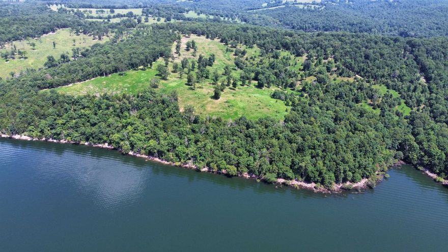 This is a rare opportunity to own a premier 120-acre lakefront property, nestled in the scenic Clark's Ridge area, just northwest of Mountain Home, Arkansas. Located at the end of a public road, this secluded property ensures ultimate privacy while delivering panoramic, million-dollar views of Lake Norfork. This stunning tract offers over 7,000 feet of boundary adjoining the U.S. Army Corps of Engineers’ wildlife management area, providing unmatched lake access and excellent hunting opportunities.  Whether you’re looking to build your dream home or invest in a unique recreational retreat, this property offers it all—including some of the most breathtaking vistas on the lake. Listed for $1,245,000.