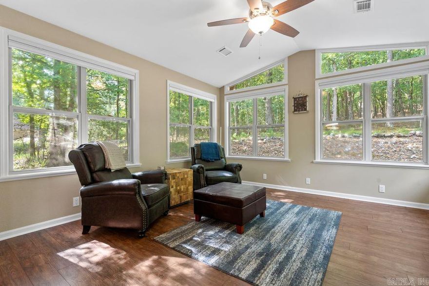 Welcome to 13 Campeon Lane – a beautifully maintained retreat nestled in the heart of Hot Springs Village! Step inside to an open-concept living area filled with natural light and vaulted ceilings. The kitchen features modern appliances, plenty of Granite counter space, and a breakfast bar that flows into the dining and living areas—perfect for entertaining or relaxing.  Enjoy peaceful mornings or tranquil evenings in the Arkansas Room overlooking the natural landscape. The spacious primary suite includes a walk-in closet and ensuite bath with double vanities and walk-in shower. Two additional bedrooms offer flexibility for guests, office space, or hobbies. Roof Replaced 2024. HVAC in attic updated. Updated Windows. New LVP Flooring and Tile.   Located in a quiet cul-de-sac, this home is just minutes from golf courses, lakes, and miles of scenic trails. Furniture is negotiable!