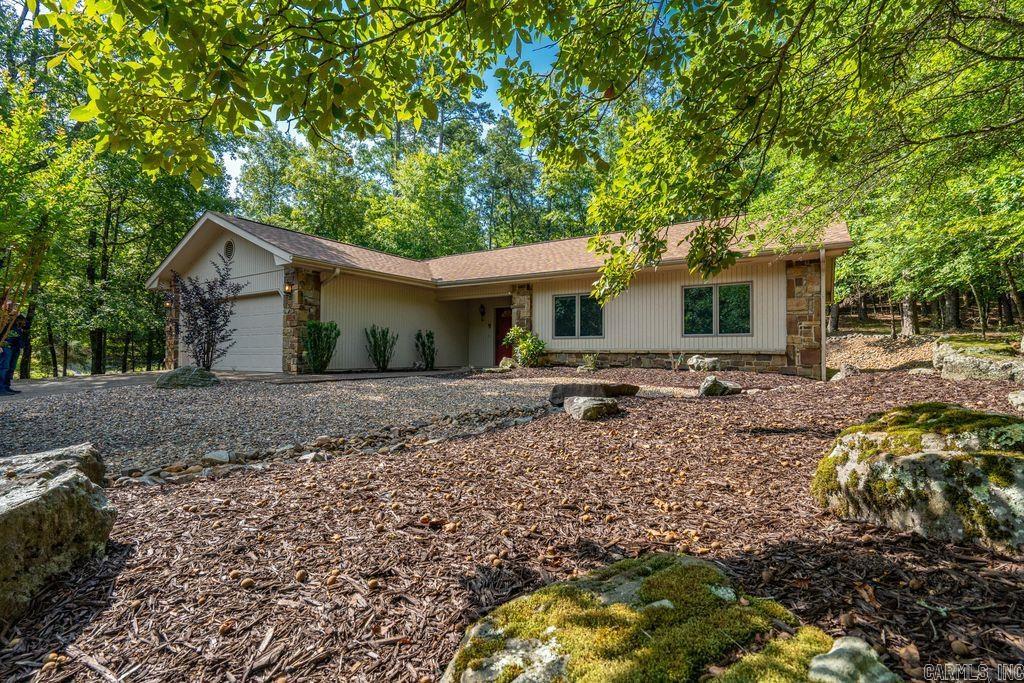 Welcome to 13 Campeon Lane – a beautifully maintained and Fully Furnished retreat nestled in the heart of Hot Springs Village! This charming 3-bedroom, 2-bath home offers a turn-key opportunity for full-time living, a vacation getaway, or a short-term rental investment. Step inside to an open-concept living area filled with natural light, vaulted ceilings, and tasteful furnishings that are all included. The kitchen features modern appliances, plenty of counter space, and a breakfast bar that flows into the dining and living areas—perfect for entertaining or relaxing. Enjoy peaceful mornings or tranquil evenings in the Arkansas Room overlooking the natural landscape. The spacious primary suite includes a walk-in closet and ensuite bath with double vanities and walk-in shower. Two additional bedrooms offer flexibility for guests, office space, or hobbies. Roof Replaced 2024. HVAC in attic updated. Updated Windows. New LVP Flooring and Tile. Located in a quiet cul-de-sac, this home is just minutes from golf courses, lakes, and miles of scenic trails. Whether you're moving in or investing, all you need to bring is your toothbrush!